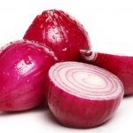 Fresh red onion over white background