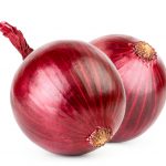 Two red onions on a white background, close-up. Isolated